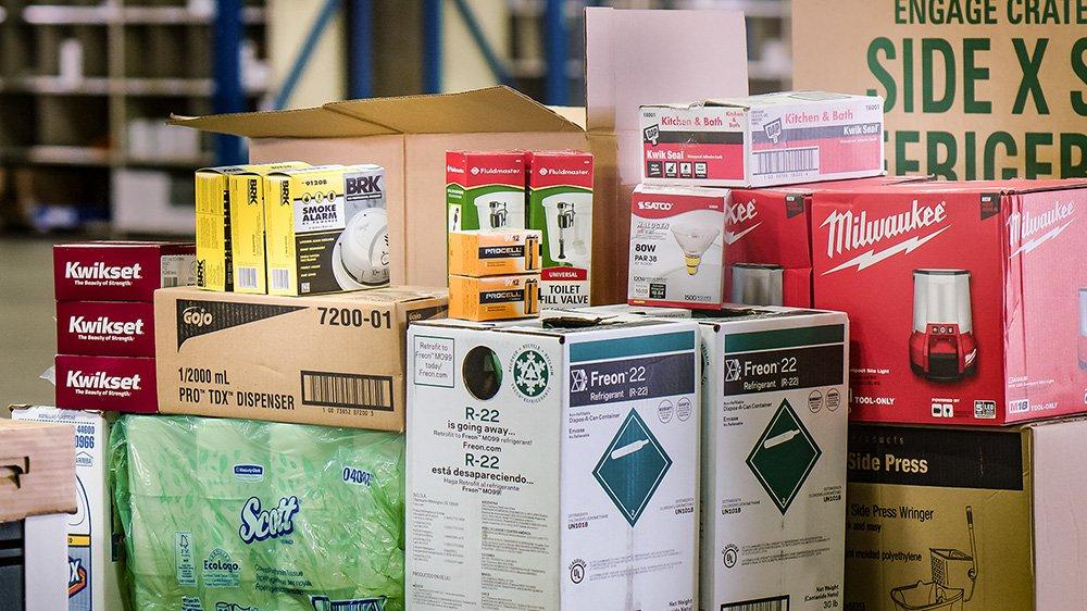 An assortment of Facilites Supply products stacked on top of each other in Front Royal distribution center.